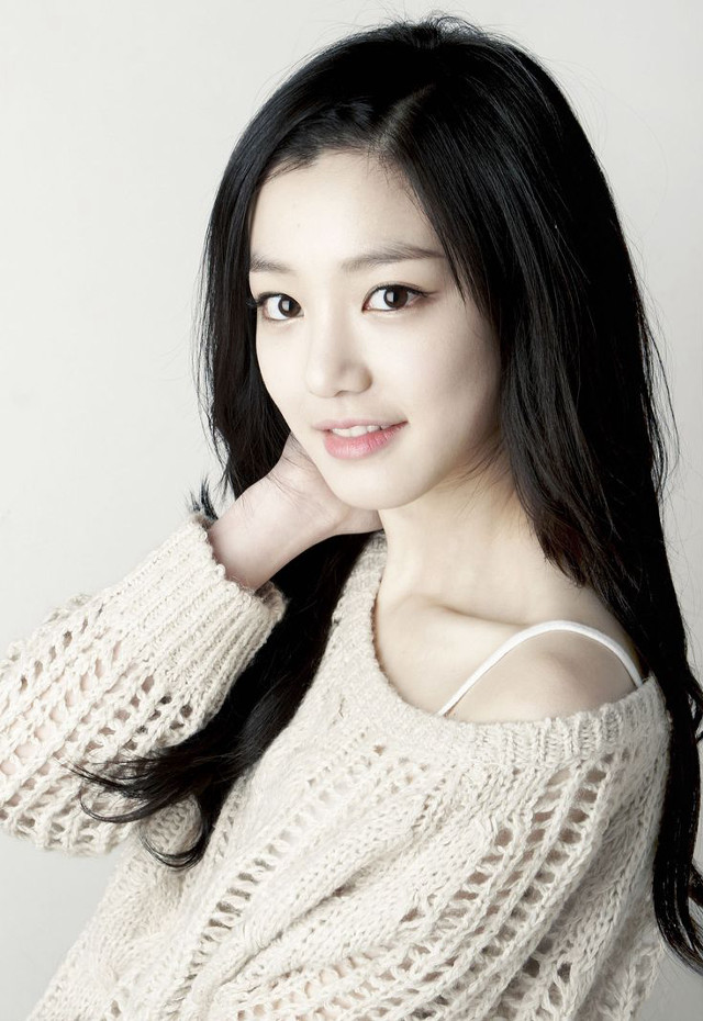 Woman black hair white sweater free wallpaper for mobile - medium preview image