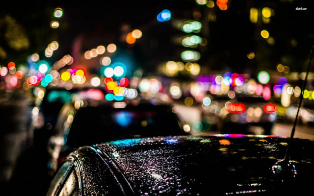 Car parked busy street night #2 free wallpaper for desktop - medium preview image