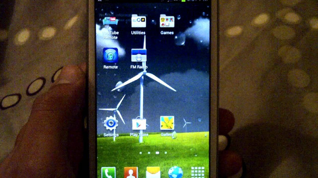 Person holding smartphone windmill screen free wallpaper for desktop - medium preview image