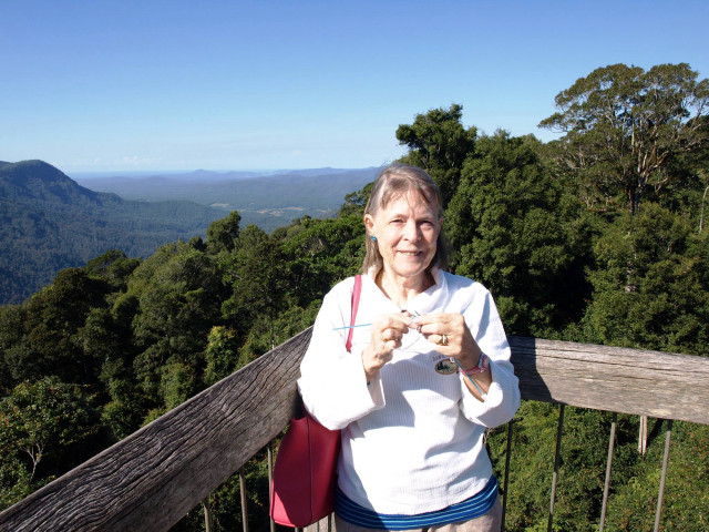 Woman wooden balcony mountains trees free wallpaper for desktop - medium preview image