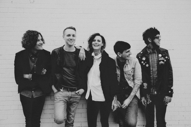 Group people standing brick wall free wallpaper for desktop - medium preview image