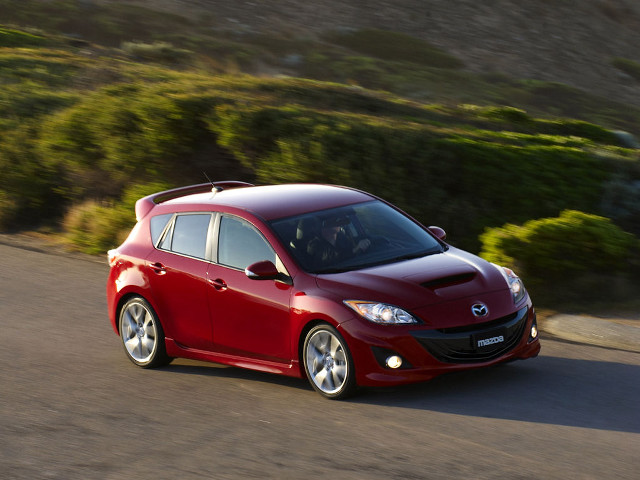 Red car driving road green free wallpaper for desktop - medium preview image