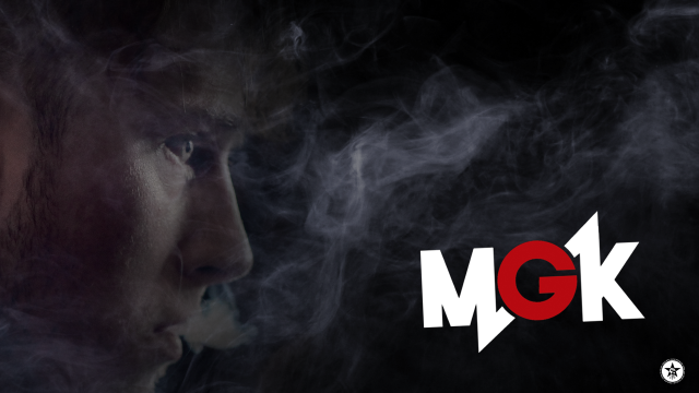 Man smoking cigarette gk logo free wallpaper for desktop - medium preview image