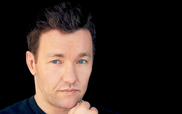 Man watch serious look camera free wallpaper for desktop - medium preview image