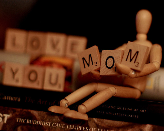 Wooden man holding block mom free wallpaper for desktop - medium preview image