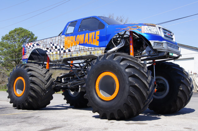 Monster truck huge tires parking free wallpaper for desktop - medium preview image