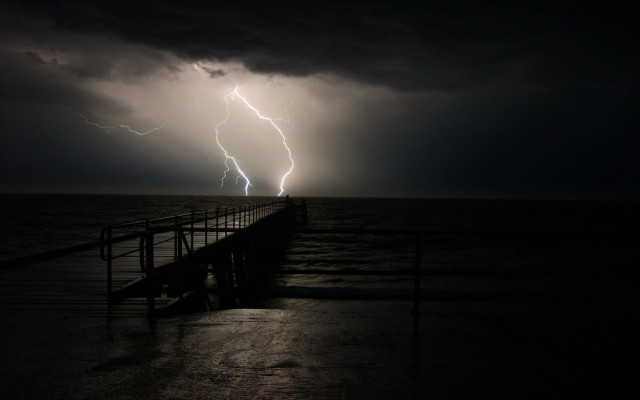 Lightning bolt pier night ocean free wallpaper for desktop - medium preview image