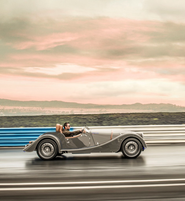 Vintage car driving road sky free wallpaper for tablet - medium preview image