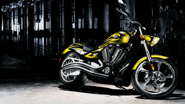 Yellow motorcycle dark room cage free wallpaper for desktop - medium preview image