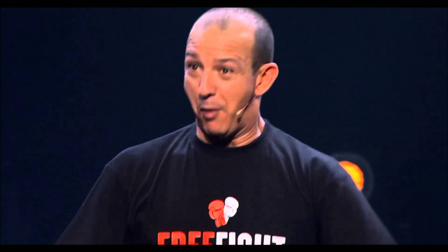 Bald man black shirt making free wallpaper for desktop - medium preview image