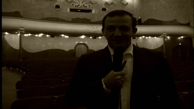 Man suit tie stage lights free wallpaper for desktop - medium preview image