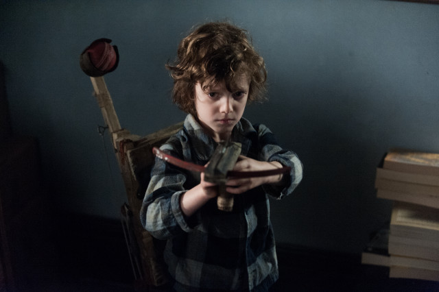 Young boy holding knife wooden free wallpaper for desktop - medium preview image