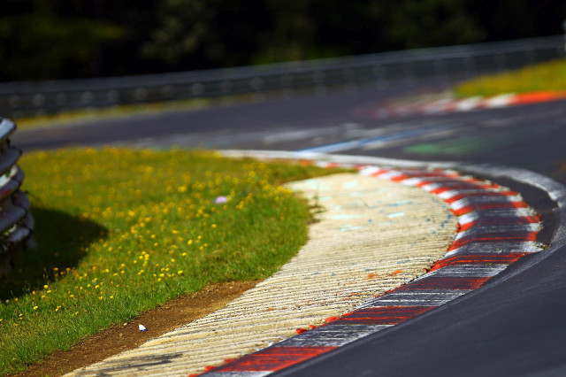 Motorcycle race track grass flowers free wallpaper for desktop - medium preview image