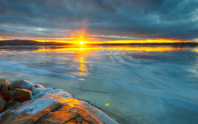 Sunset frozen lake rocks ice free wallpaper for desktop - medium preview image