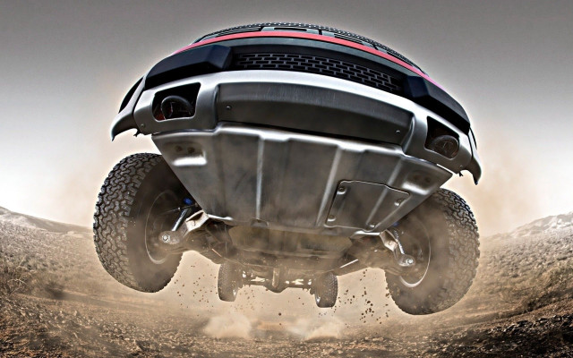 Large truck jumping dirt road free wallpaper for desktop - medium preview image
