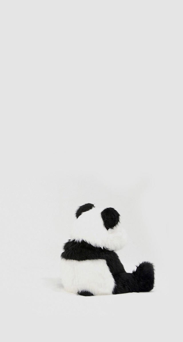 Stuffed panda bear white surface free wallpaper for mobile - medium preview image
