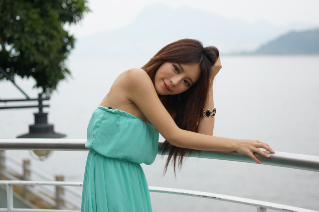 Woman green dress water railing free wallpaper for desktop - medium preview image