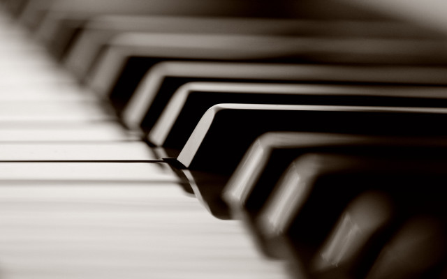 Piano keys closeup blurry background free wallpaper for desktop - medium preview image
