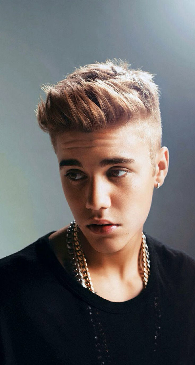 Young man short haircut serious free wallpaper for mobile - medium preview image