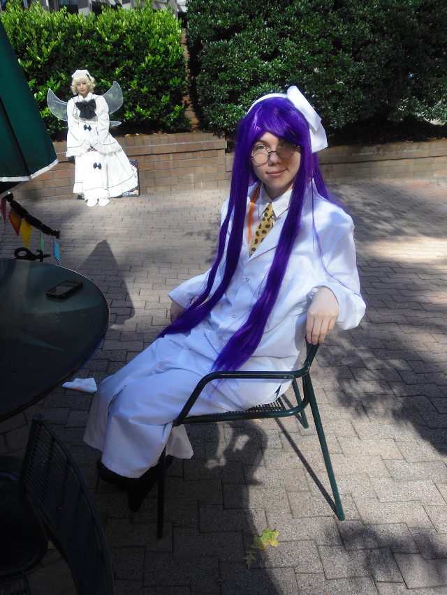 Purple haired cosplay woman outdoors free wallpaper for mobile - medium preview image