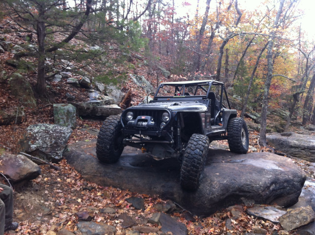 Jeep parked rock woods trees free wallpaper for desktop - medium preview image