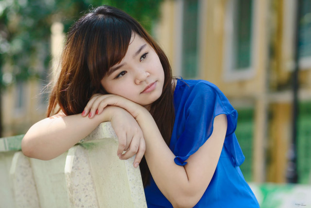 Woman leaning bench blue shirt free wallpaper for desktop - medium preview image