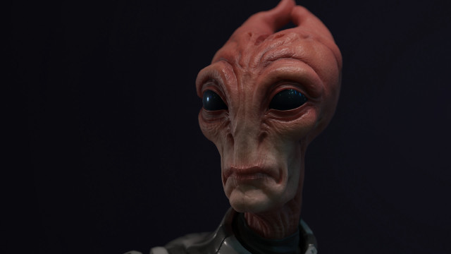 Red alien mask closeup black free wallpaper for desktop - medium preview image