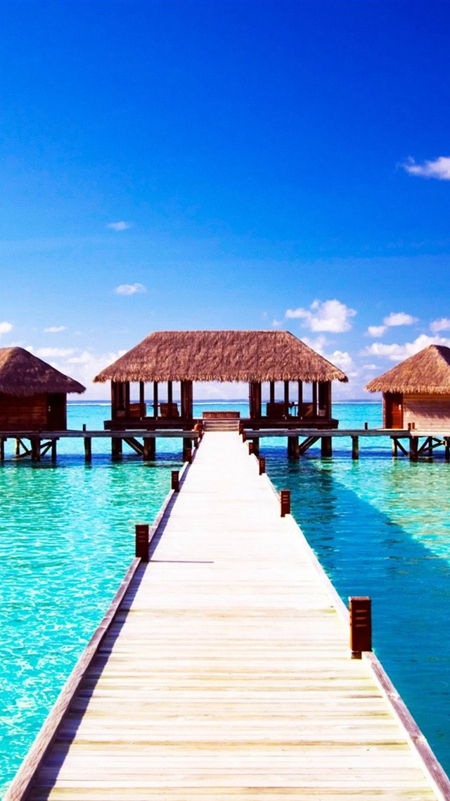 Pier beach thatched huts water free wallpaper for mobile - medium preview image