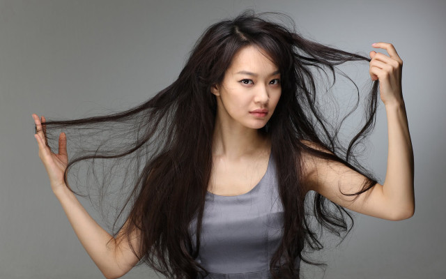 Woman long hair holding hair free wallpaper for desktop - medium preview image