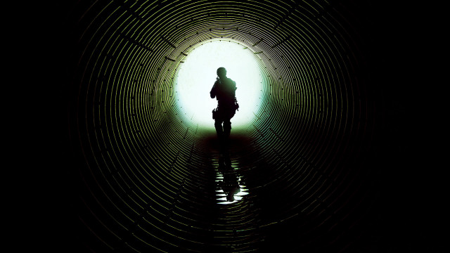 Person standing dark tunnel bike free wallpaper for desktop - medium preview image