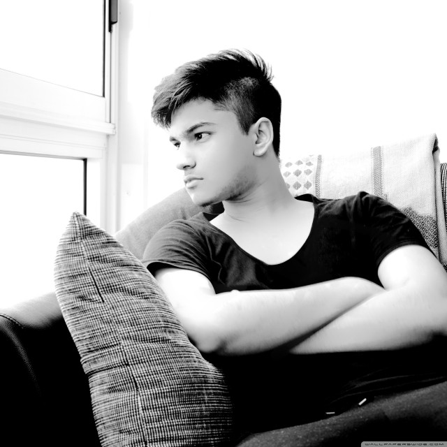 Man sitting couch arms crossed free wallpaper for tablet - medium preview image