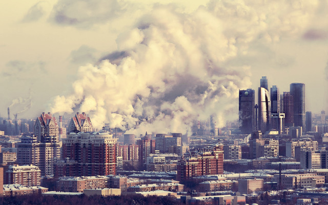 Smoky cityscape industrial buildings background free wallpaper for desktop - medium preview image