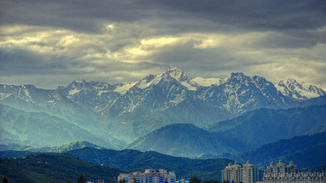 Mountain range city cloudy sky free wallpaper for desktop - medium preview image