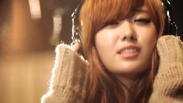 Woman headphones sweater shoulders listening free wallpaper for desktop - medium preview image