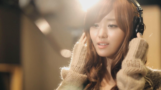 Woman headphones cellphone smiling sweater free wallpaper for desktop - medium preview image