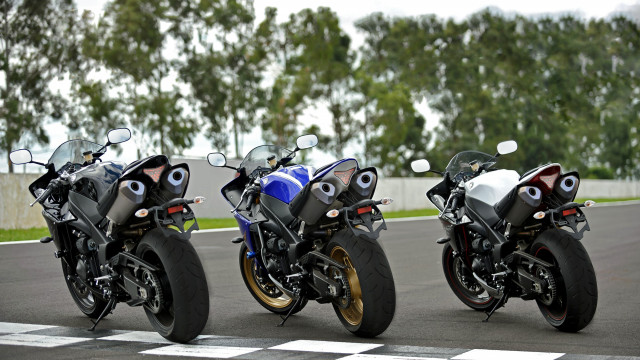 Motorcycles parked race track trees free wallpaper for desktop - medium preview image