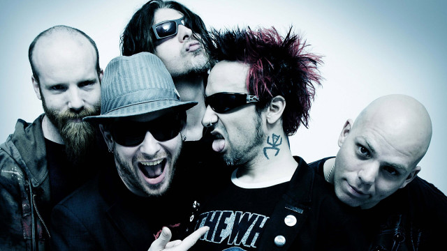 Tattooed men piercings group pose free wallpaper for desktop - medium preview image