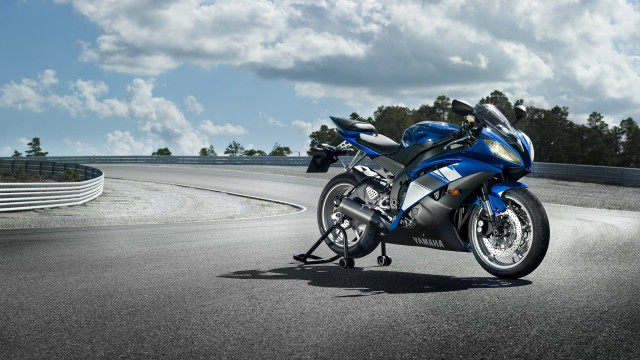 Blue motorcycle parked road hill free wallpaper for desktop - medium preview image