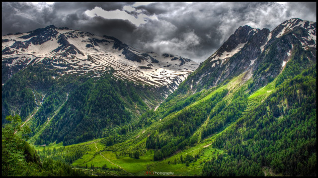 Mountain range valley forest cloudy free wallpaper for desktop - medium preview image