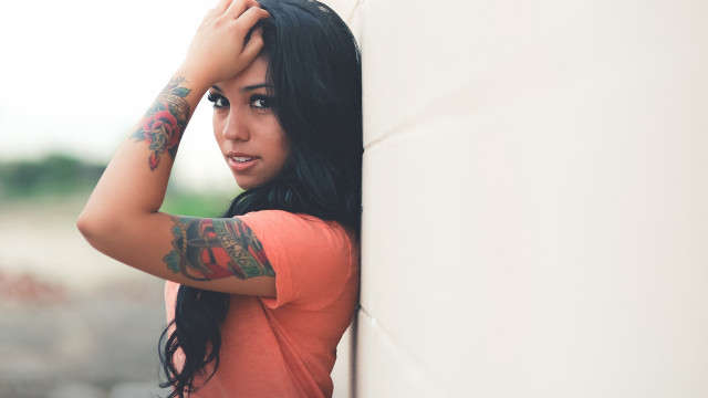 Woman tattoos leaning wall hands free wallpaper for desktop - medium preview image