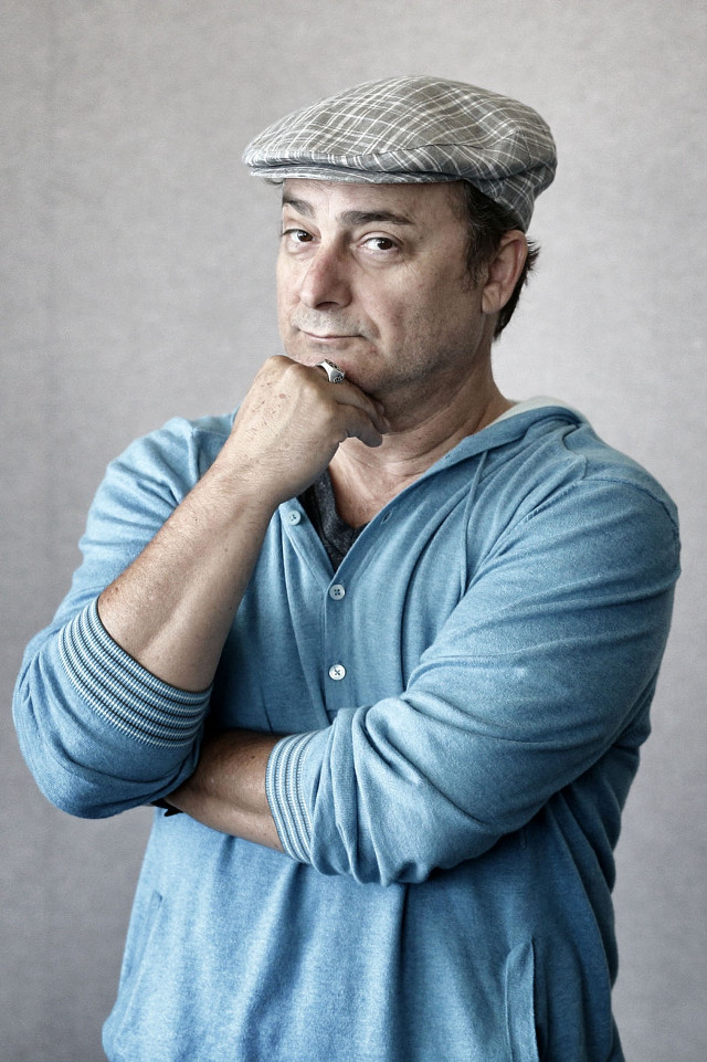 Man hat posing hand chin free wallpaper for mobile - medium preview image