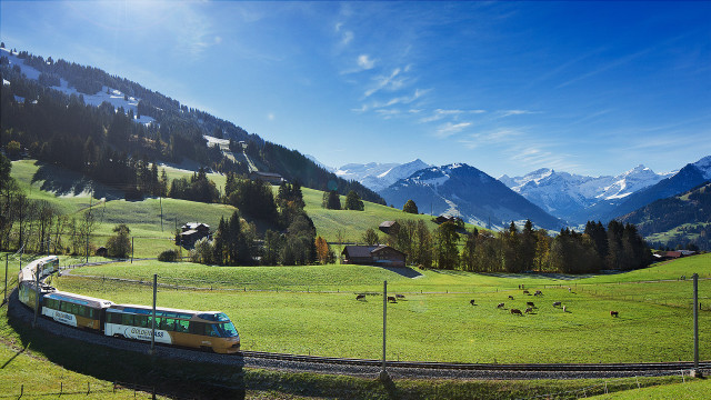 Lush green countryside train mountains free wallpaper for desktop - medium preview image