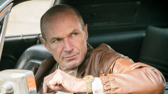 Man leather jacket sitting car free wallpaper for desktop - medium preview image