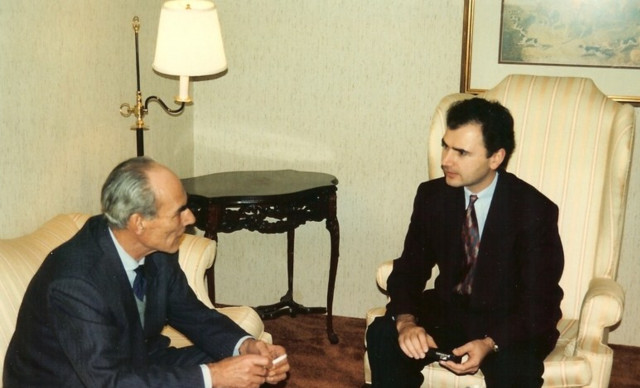 Two men suits sitting talking free wallpaper for desktop - medium preview image