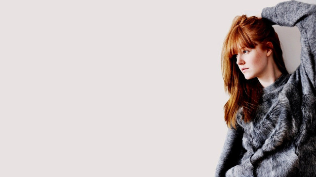 Woman red hair gray coat free wallpaper for desktop - medium preview image