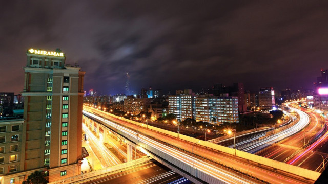 City skyline freeway bridge nighttime free wallpaper for desktop - medium preview image