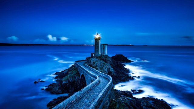 Lighthouse rocky shore blue sky free wallpaper for desktop - medium preview image