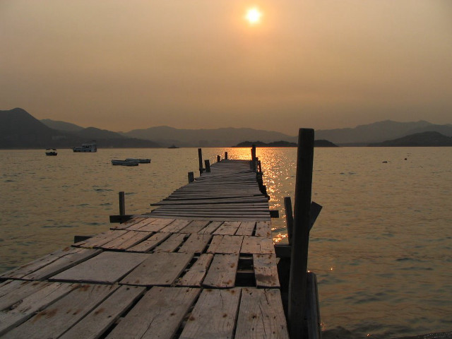 Wooden dock boat sunset mountains free wallpaper for desktop - medium preview image
