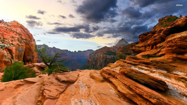 Mountain tall cliff cloudy sky free wallpaper for desktop - medium preview image