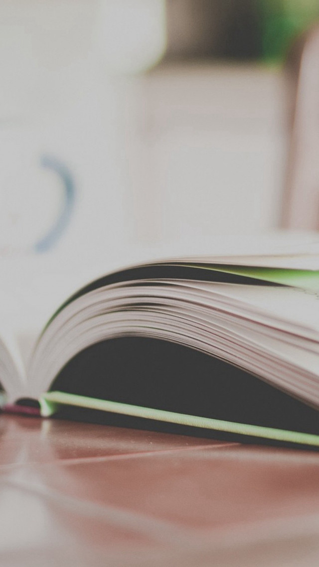 Open book table blurry background free wallpaper for mobile - medium preview image